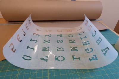 How to flatten out a curled stencil